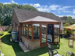 a conservatory with a tiled roof from Nu-Look Conservatory Roof Solutions